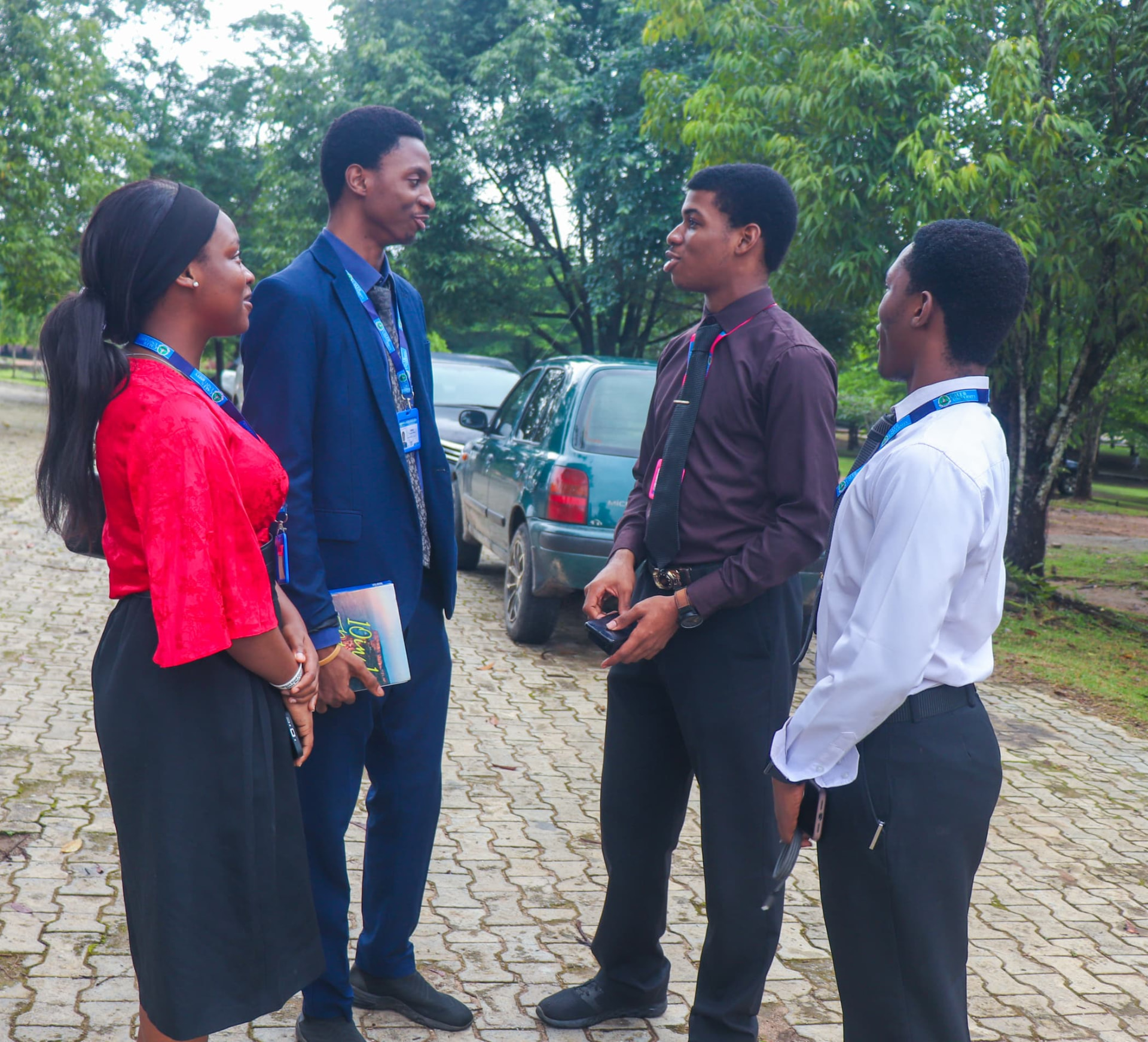 Group of students chatting together on the campus walkway