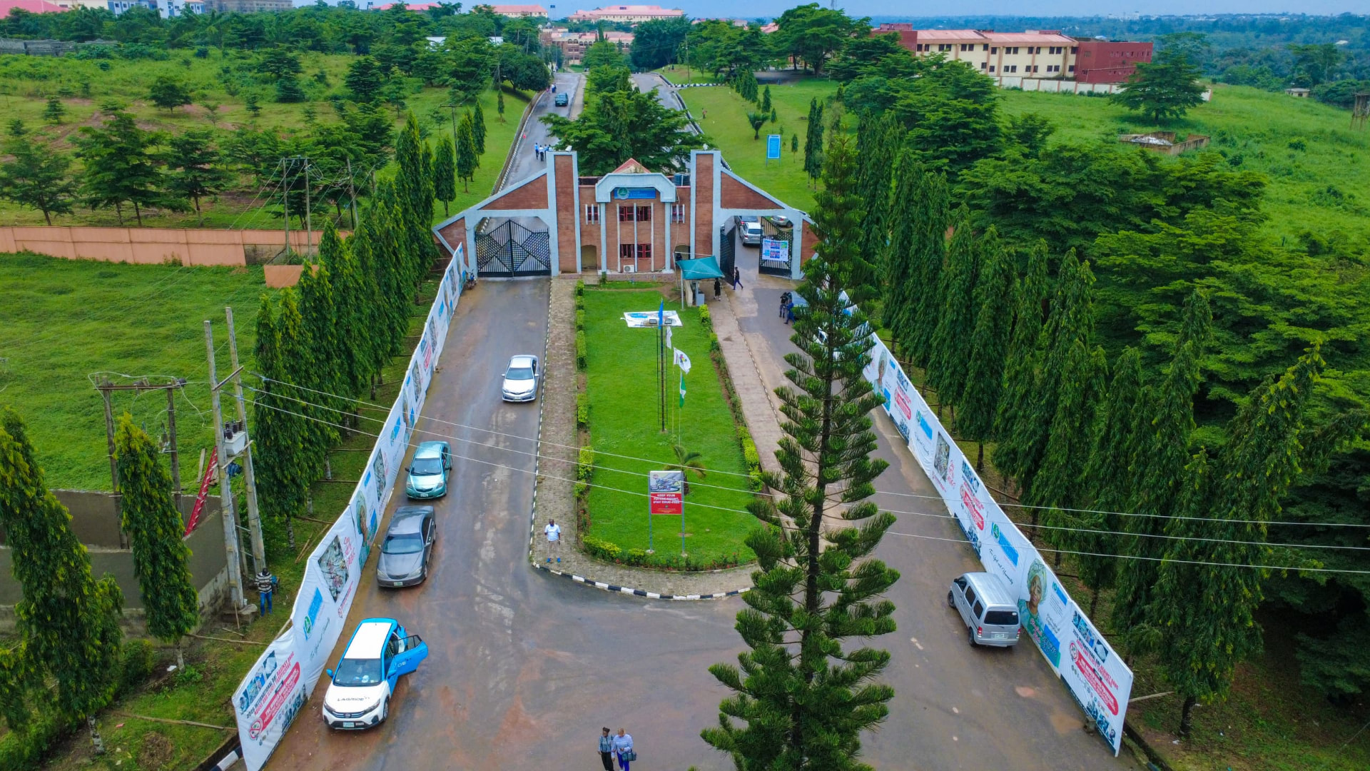 Aerial view of the campus approach road and buildings
